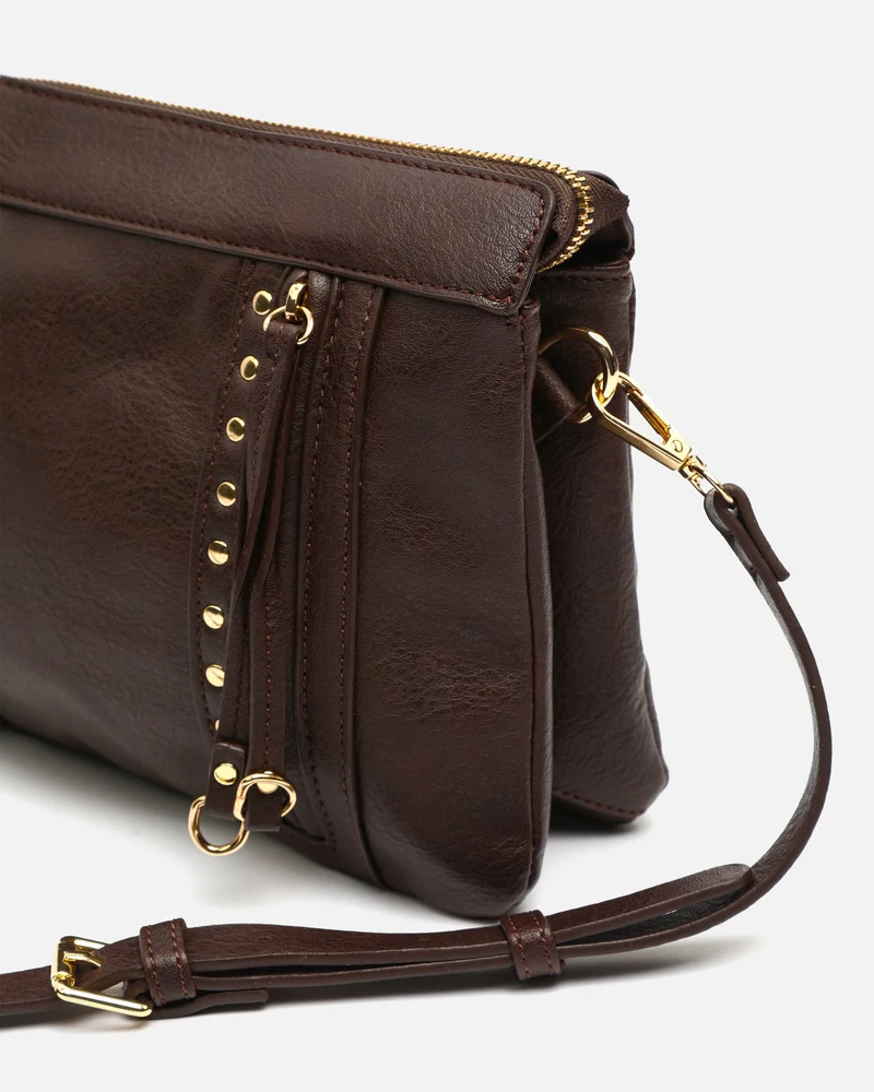 Nikasi bolso bandolera con detalles metálicos